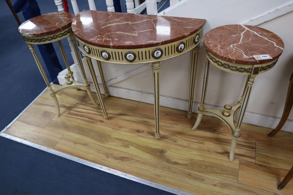 A pair of parcel gilt cream painted occasional tables with rouge marble tops and a similar demi-lune table with cracked marble top